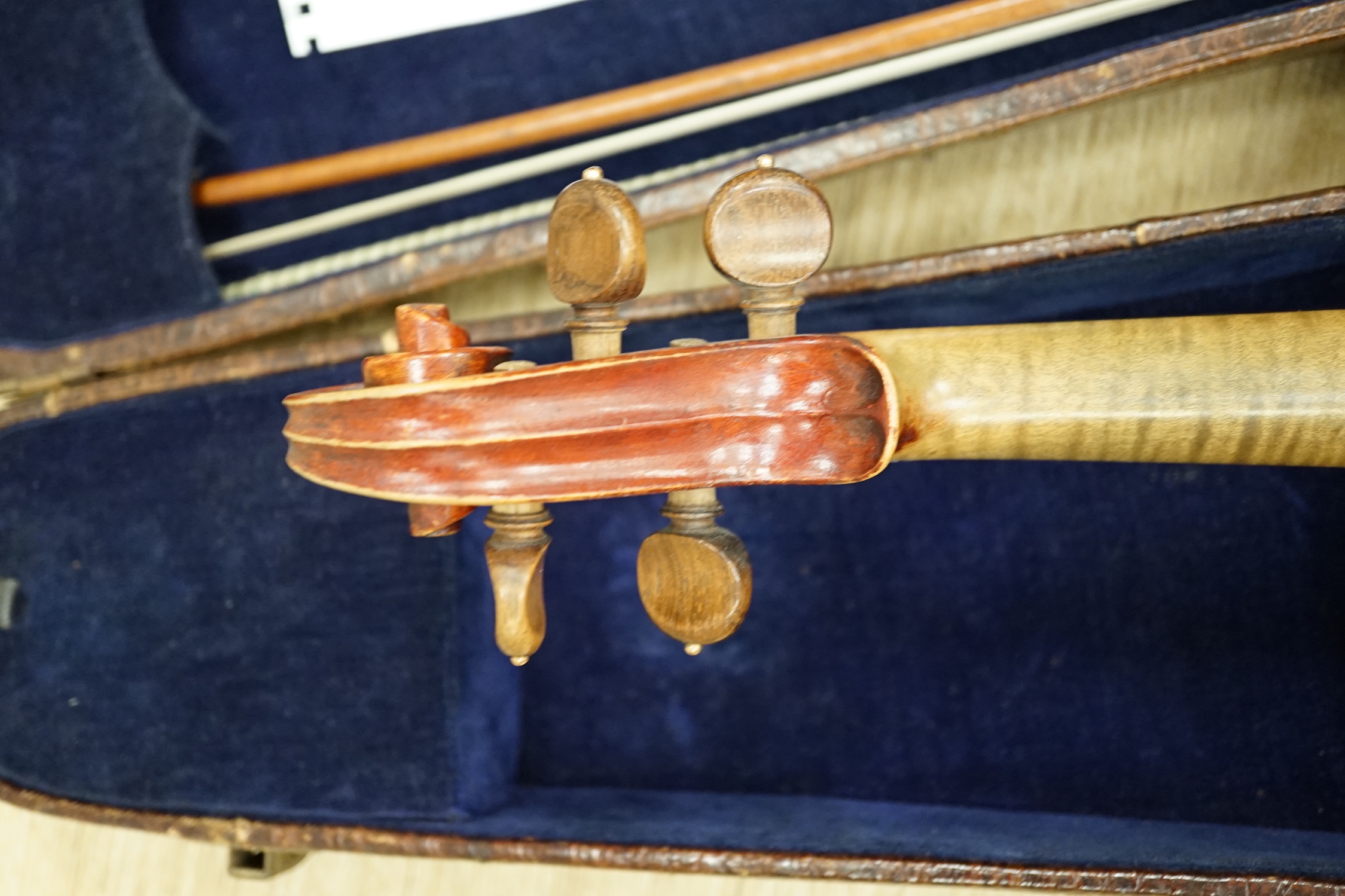 An English cased violin by Thomas J. Bellingham, Leeds, 1909, body length, 35.5cm, with a chased silver mounted bow CITES Submission reference WNR7TU27